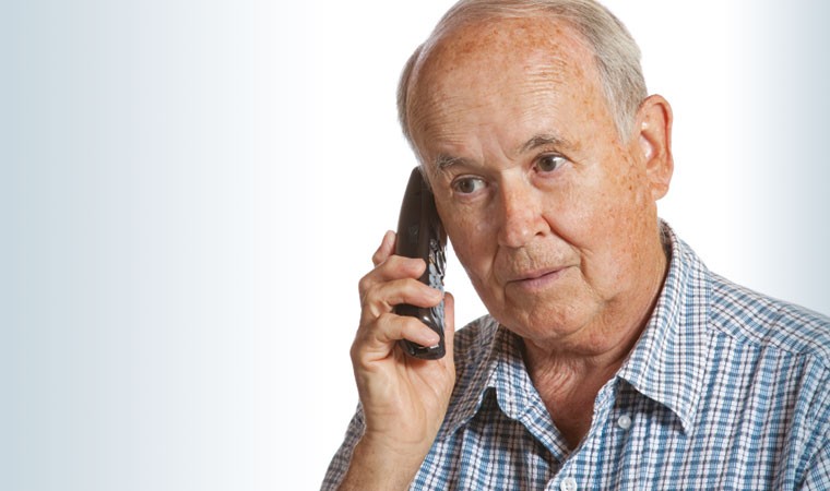 Older man on cordless phone