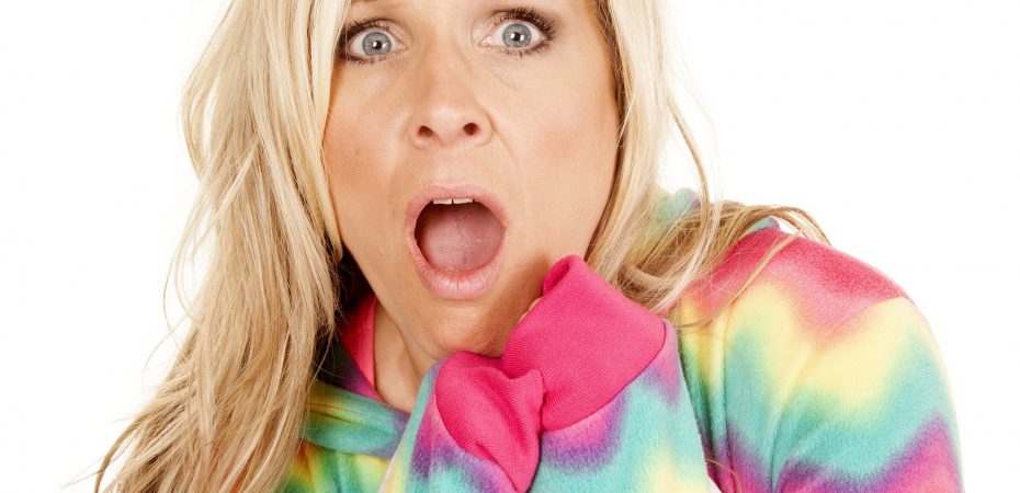 Woman in pyjamas with shocked expression
