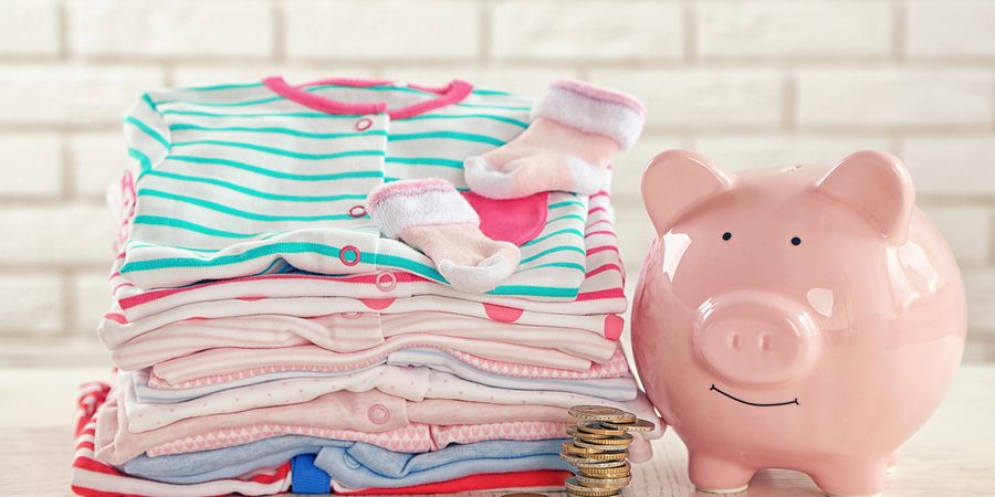 Folded laundry and piggy bank