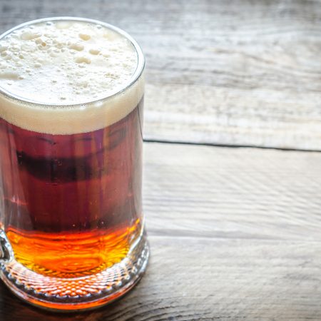 Pint of beer on wooden table