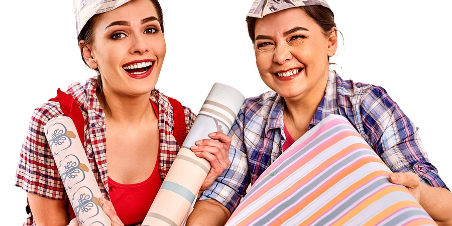 Women with wallpaper doing up home