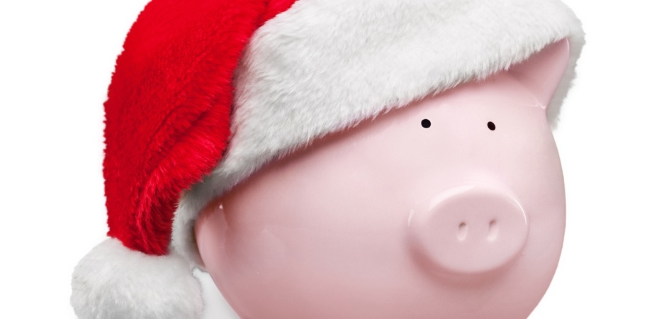 Piggybank wearing santa hat