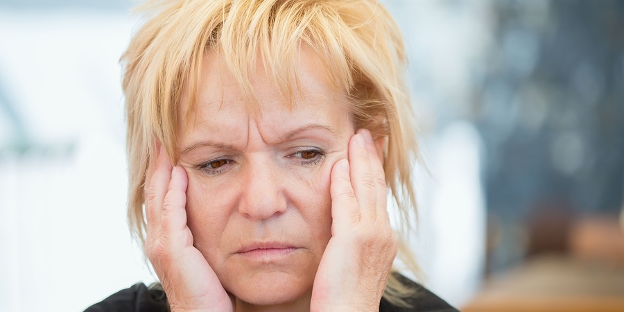 Very worried middle-aged woman