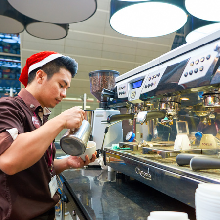 Young man working in coffee shop