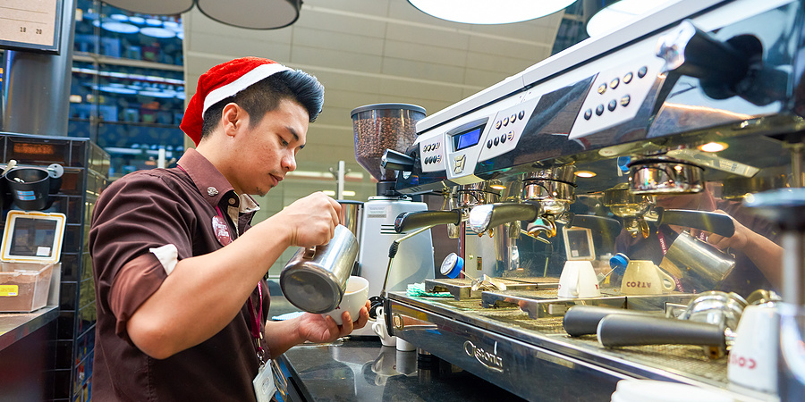 Young man working in coffee shop