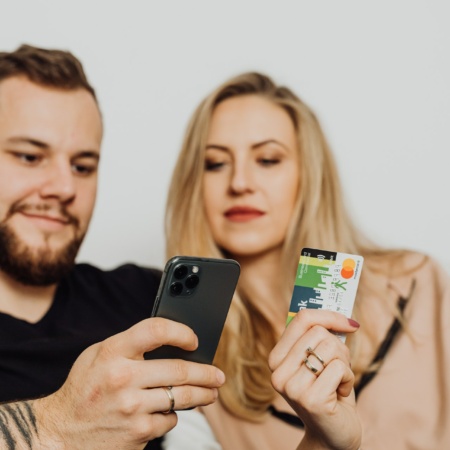 Couple with a phone and credit card