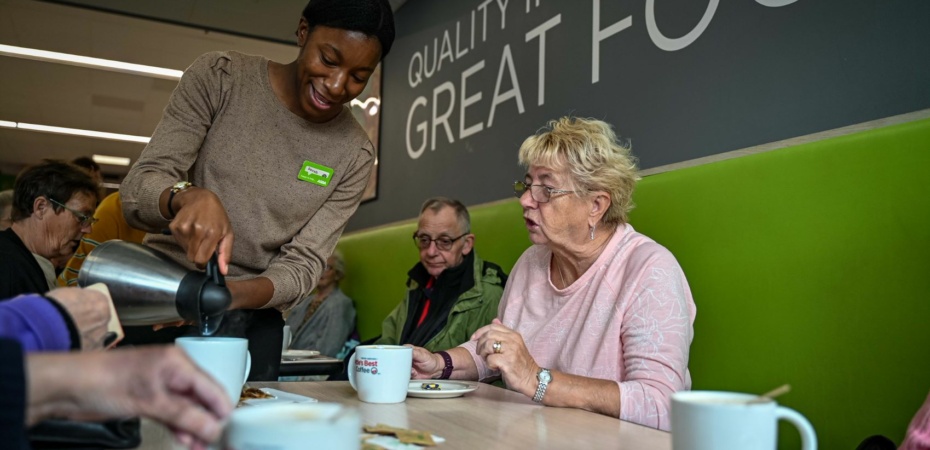 Customer and worker in Asda cafe