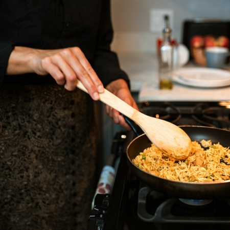 Woman frying rice