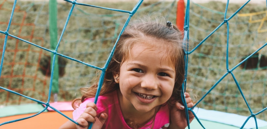 Smiling little girl playing outside