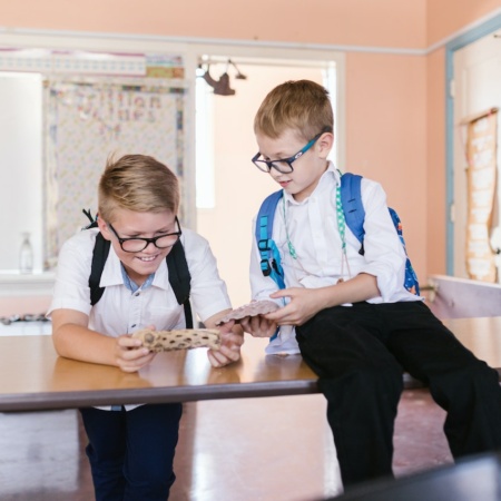 Two young boys in a school classroom