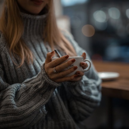 Woman holding a hot drink
